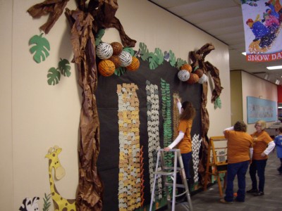 Staff members tally scores on the Safari display